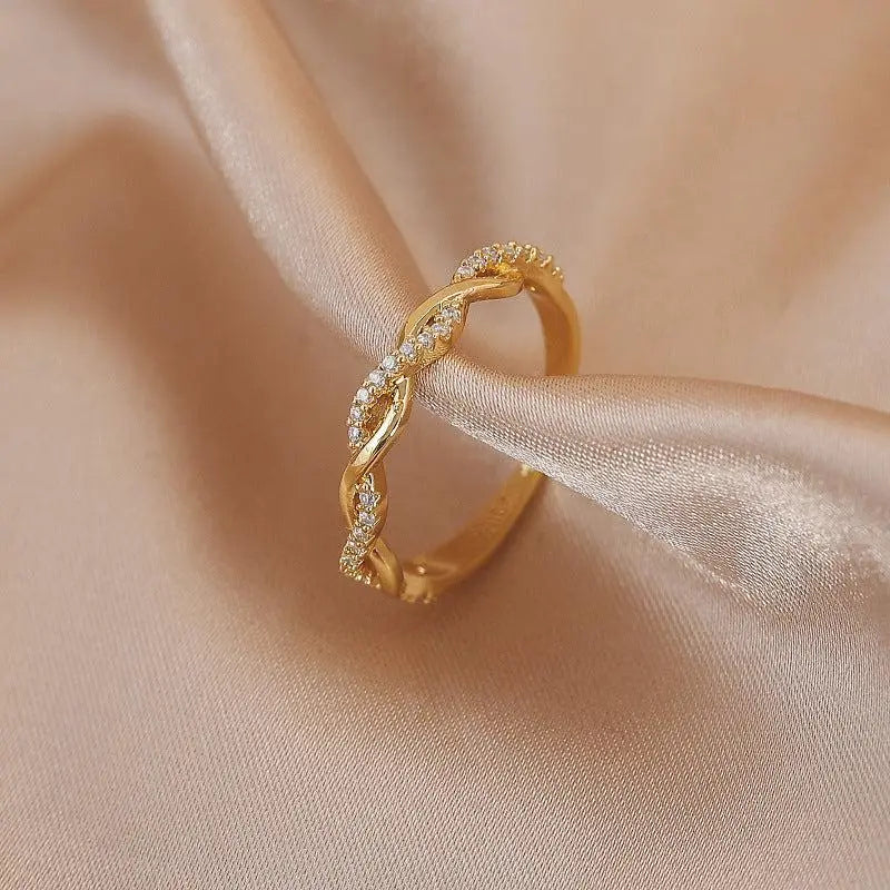 Adjustable ring with gold braided zirconia stones 0