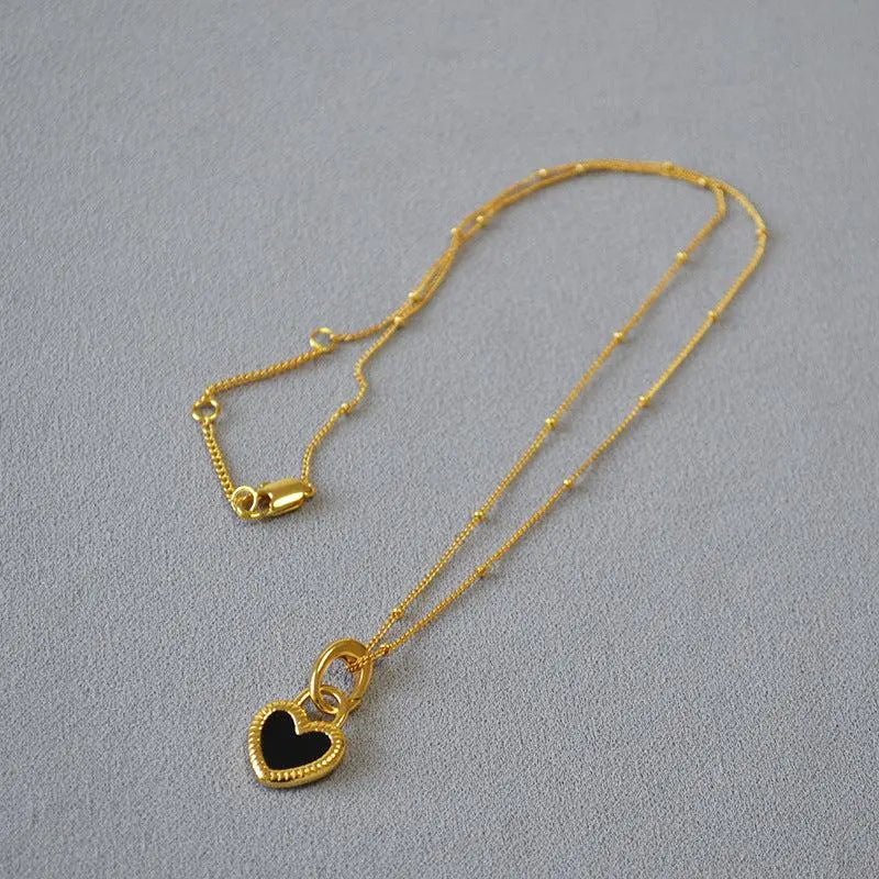 Black and White Heart Necklace in Gold 2