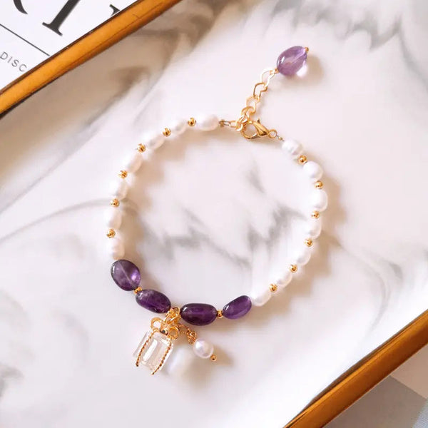 Bracelet with purple stones and pearls in gold 0