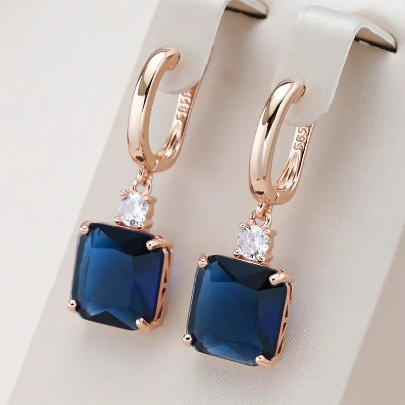 Elegant earrings with dark blue crystal in gold 0