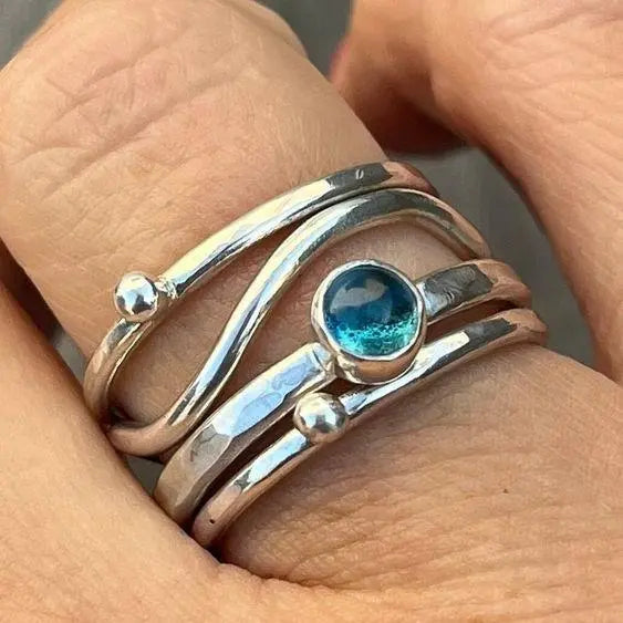 Layered ring with blue crystal 0