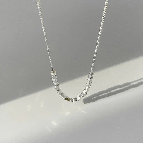 Modern pearl-inspired necklace with a sleek chain design 0