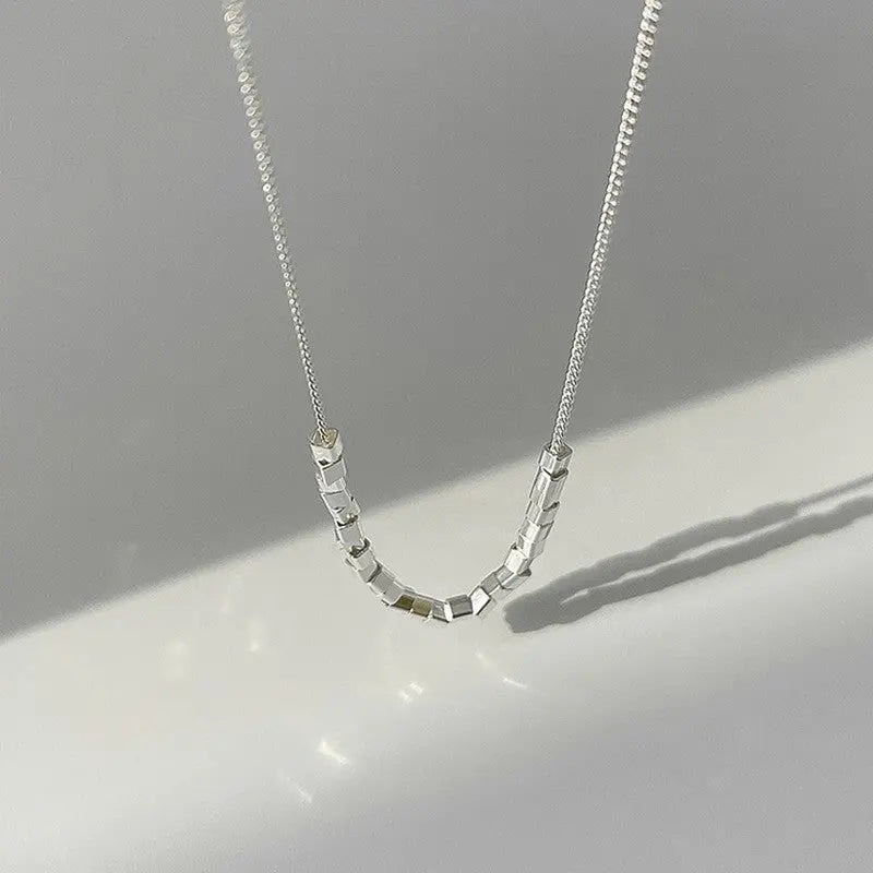 Modern pearl-inspired necklace with a sleek chain design 0