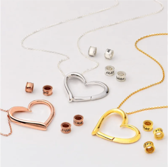 Personalized heart necklace with the option to attach rings and custom name engravings 1
