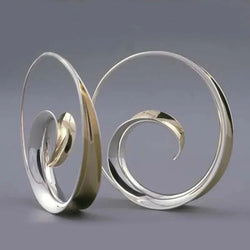 Vintage earrings with spiral waves 0